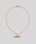 A delicate gold chain necklace featuring a small, stylized gold bone charm in the center, displayed against a solid light gray background.