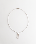 A silver chain necklace with a small silver pendant shaped like a stylized hamsa, displayed on a clean white background.